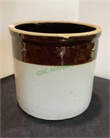 Off-white and brown glaze pottery crock. Stands 7