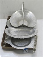 silver colored metal serving trays and dishes