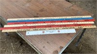 Collection Of Yard Sticks With Advertising