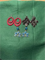 Three pair of pierced earrings