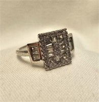 STERLING SILVER RING W/ SEVERAL CLEAR STONES