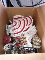 Box of miscellaneous doilies candles and more