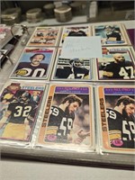 Two binders of football and baseball cards as