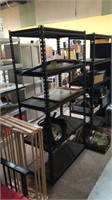 Black metal storage shelf with the wood shelving