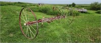 Old steel wheel hay rake.