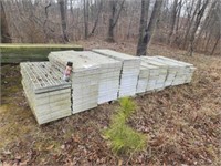 Large stack of hog panel slats.