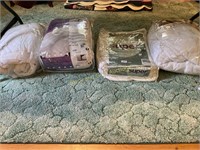 Group of four assorted mattress pads