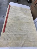 Rugs tan color. Cream 45x27. With design 2 at