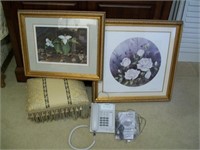 Footstool, framed prints, and phone