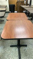 2 small wooden tables with metal bases