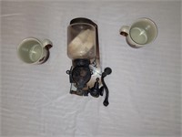 Antique coffee grinder and sandpiper mugs