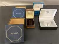 5 empty watch boxes