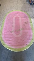 Oval hooked rug - lime green and pink.