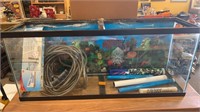 55 gallon fish tank with a pump hose for