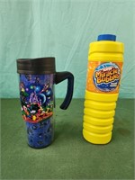 Disney World travel mug and unopened bottle of