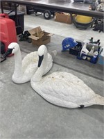 2 plastic swans