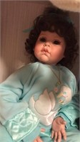 Porcelain doll w green clothes