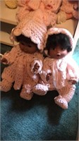 2 pink crochet dolls