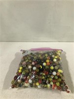 BAG OF ORANGE AND YELLOW VINTAGE MARBLES