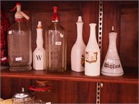 Six vintage bottles, two are soda water