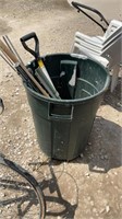 Plastic garbage can, garden tools