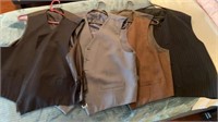 Four suit vests size unknown