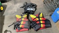 2 life jackets and tailgat net