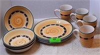 Yellow dishes with stripes: 4 cups, 4 bowls, 3