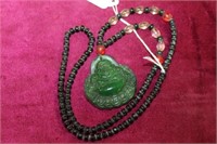 Necklace w/ carved green Buddha Pendant