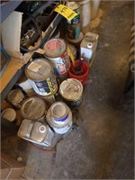 Paint supplies on bottom shelf and floor