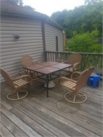 Patio table and wicker chairs. Chairs need love