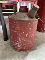 Small red metal gas can