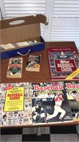 Baseball guides, sticker books, and storage box
