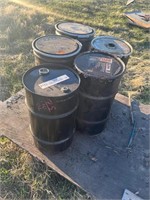 5 empty metal barrels