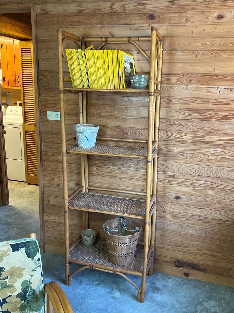 Rattan shelf and contents has lean