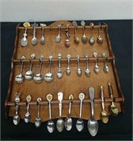 Spoon display with souvenir spoons and vintage
