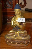 Fine gilt and patinated bronze Buddha,