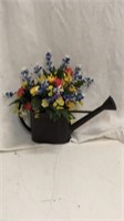 Watering can with silk flowers