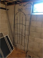 Metal trellis with two tall Shepard's hooks