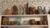 Two shelf lots with some carved wood figures