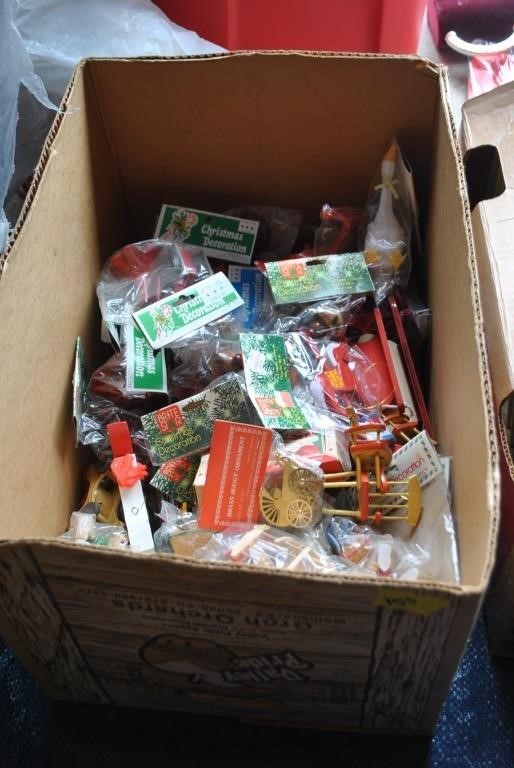 Box of mostly new Christmas decorations in package