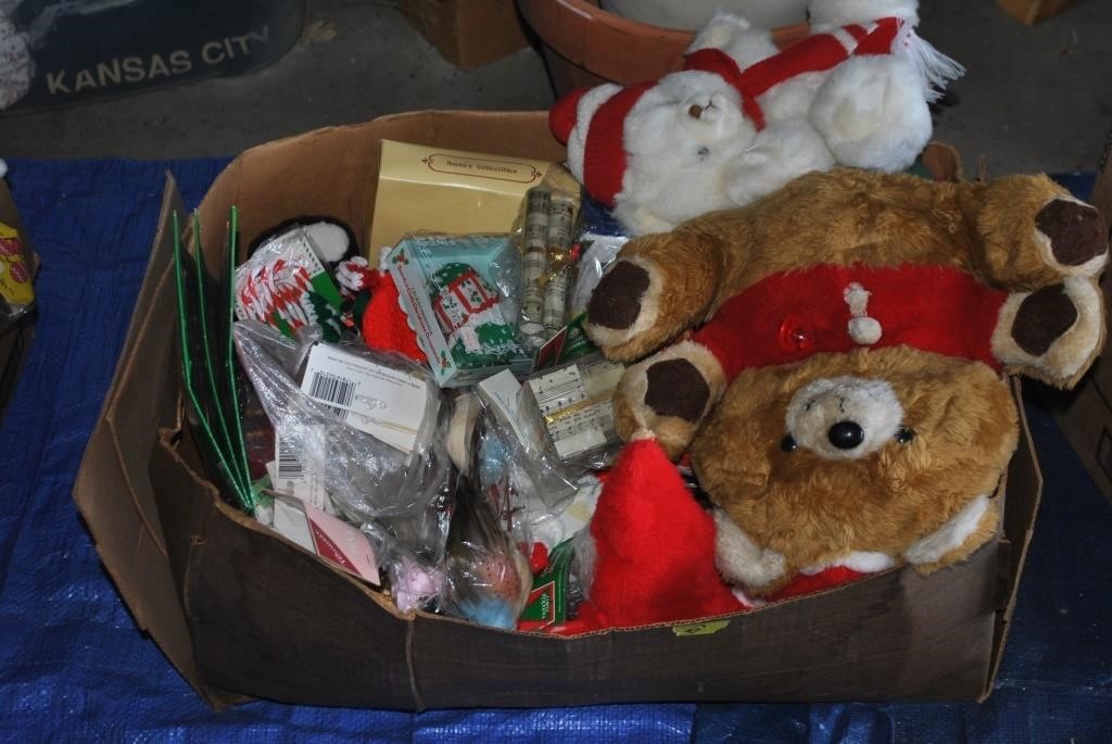 box of Christmas decorations and stuffed animals