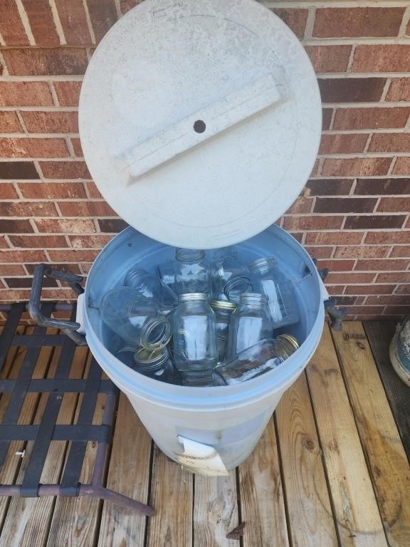 Rubbermaid trash can full of Mason jars