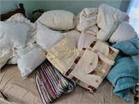 Down comforters, pillows, rag rug, pillow shams