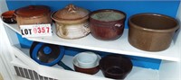 2 shelves: pottery, stoneware, fry pans