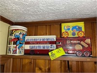 Group of Vintage tins to include super man and cur