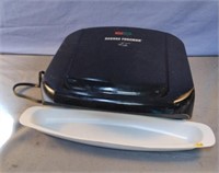 George Foreman. Powers on