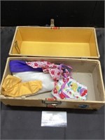 Vintage doll case with a few clothing items