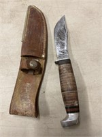 Case XX hunting knife in original leather sheath.