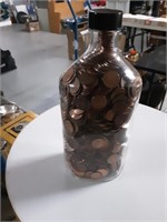 TALL VINTAGE GLASS BOTTLE FULL OF PENNIES